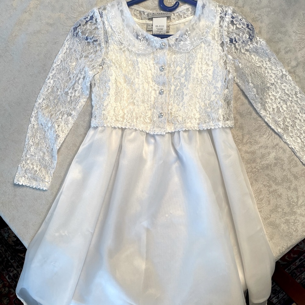 Girls white lace jacket over white shift dress